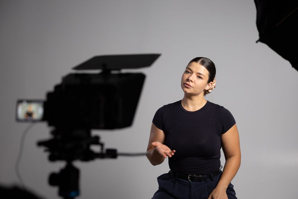 Videographer filming an interview